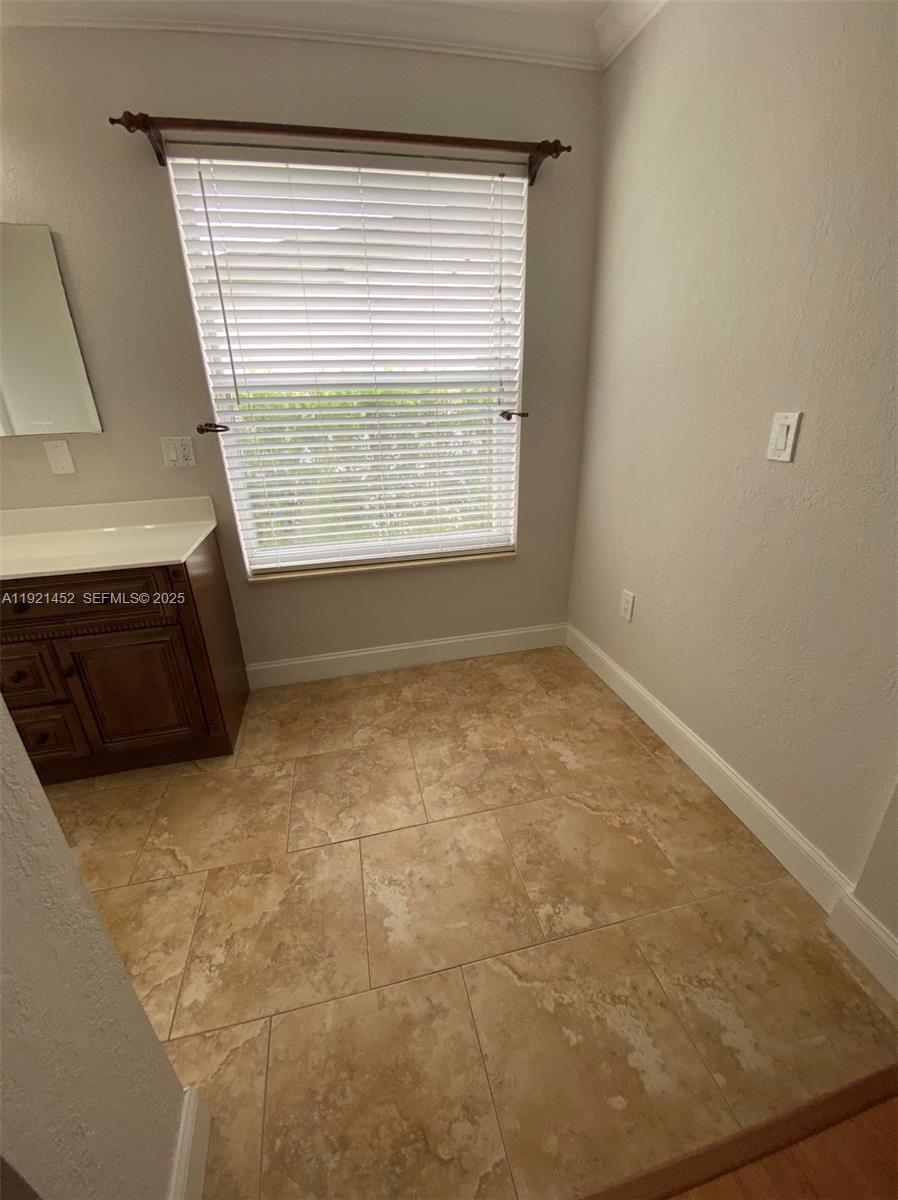 7880 Southwest 14th Terrace Miami, FL 33144 - Photo 14 of 43 a view of a livingroom with an empty space and a window
