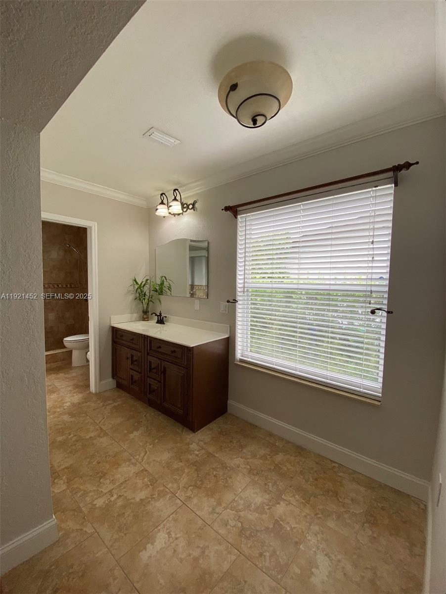 7880 Southwest 14th Terrace Miami, FL 33144 - Photo 15 of 43 a living room with furniture and a large window