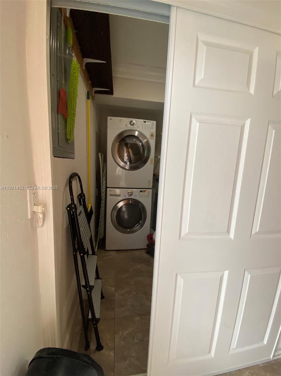 7880 Southwest 14th Terrace Miami, FL 33144 - Photo 25 of 43 a utility room with dryer and washer