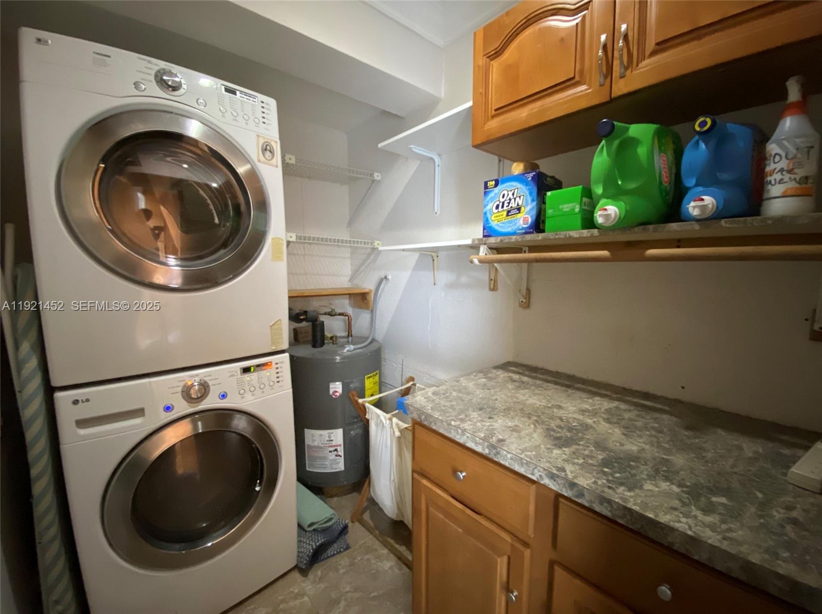 7880 Southwest 14th Terrace Miami, FL 33144 - Photo 26 of 43 a utility room with dryer and washer