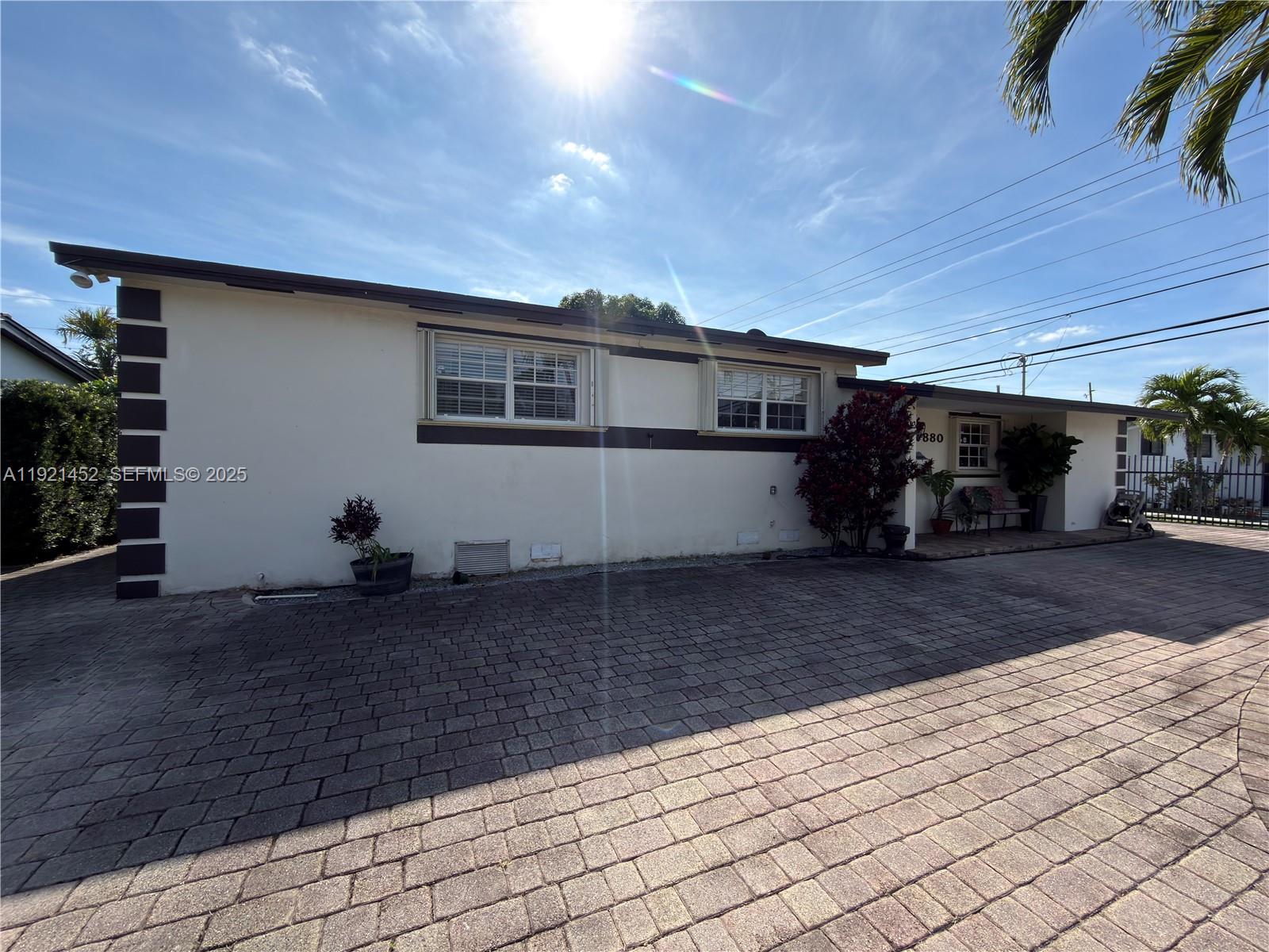 7880 Southwest 14th Terrace Miami, FL 33144 - Photo 3 of 43 a house view with a backyard space