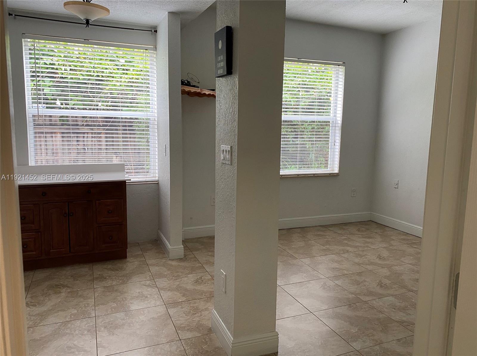 7880 Southwest 14th Terrace Miami, FL 33144 - Photo 38 of 43 a view of an empty room with a window