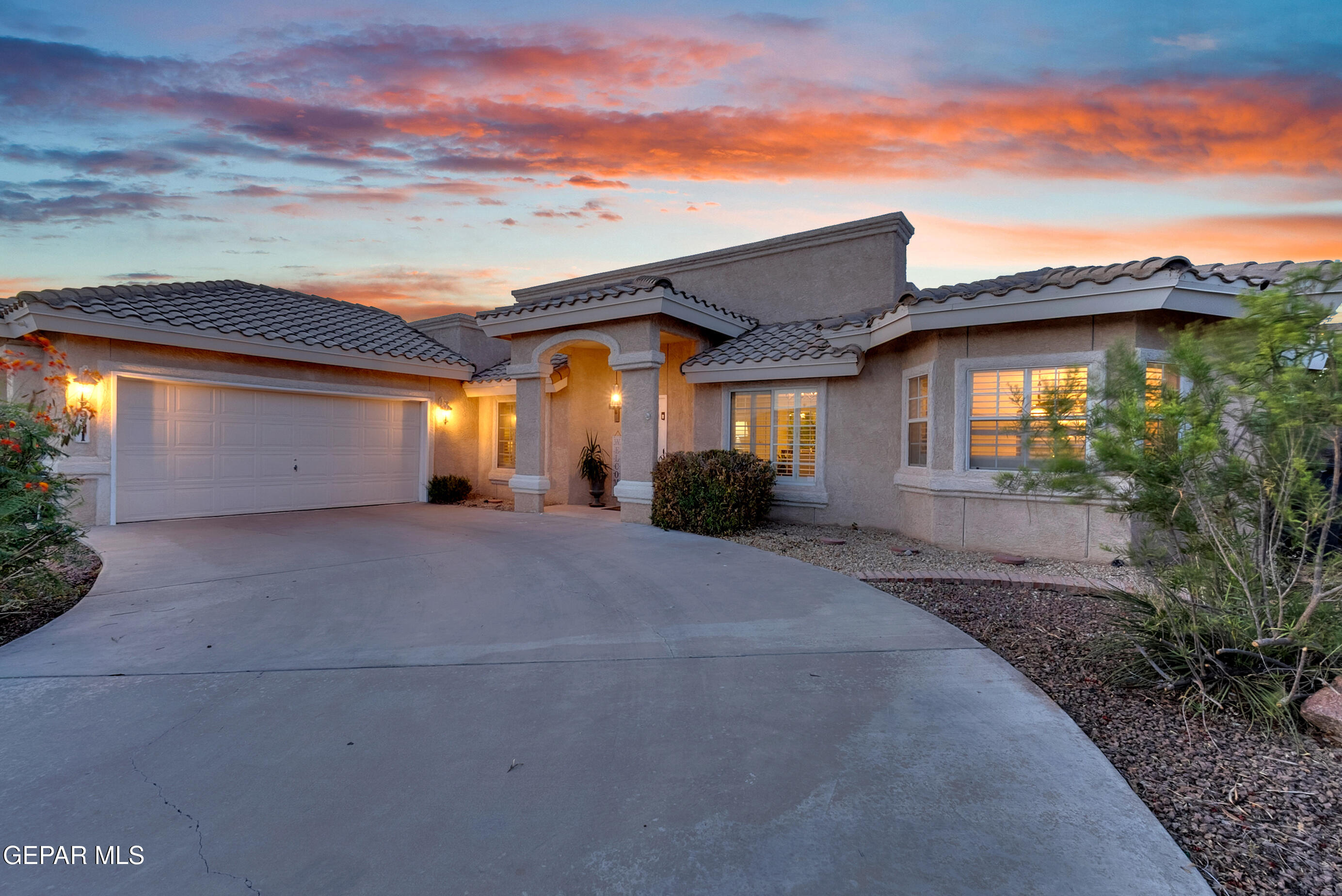 6531 Brook Ridge Circle El Paso, TX 79912 - Photo 3 of 73 a front view of a house with a yard and garage