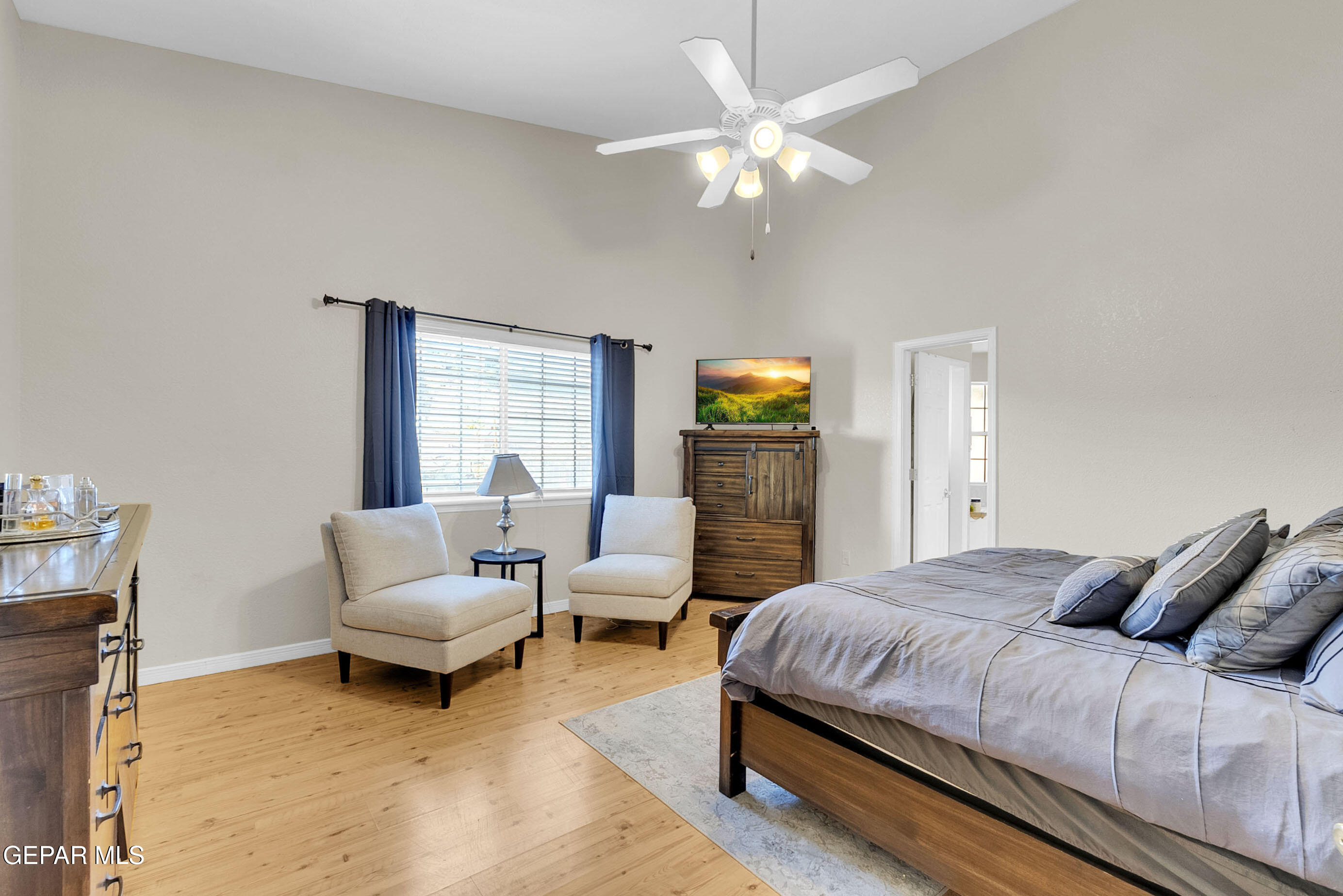 6531 Brook Ridge Circle El Paso, TX 79912 - Photo 32 of 73 a bedroom with a bed and a chandelier