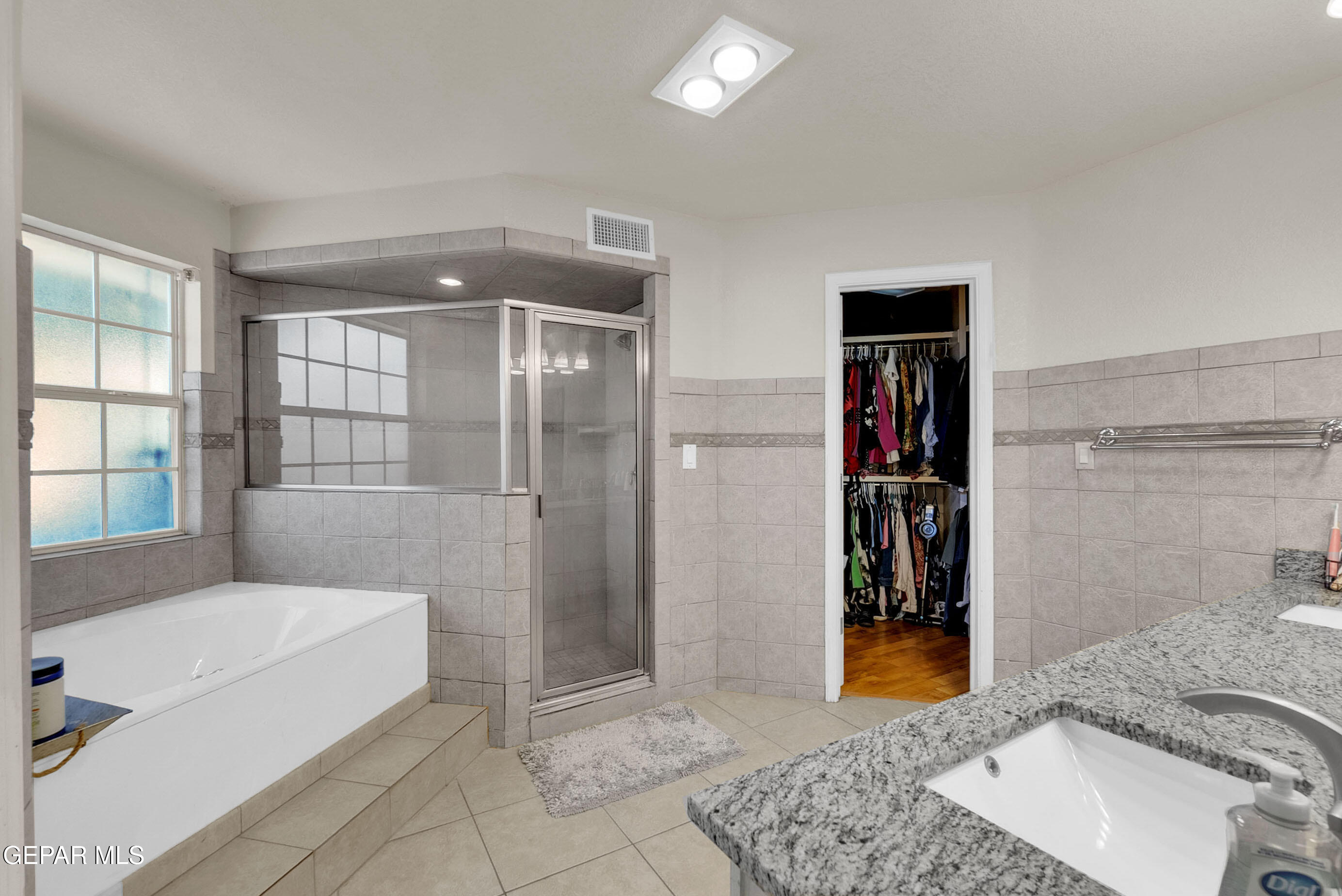 6531 Brook Ridge Circle El Paso, TX 79912 - Photo 34 of 73 a bathroom with a tub and a shower