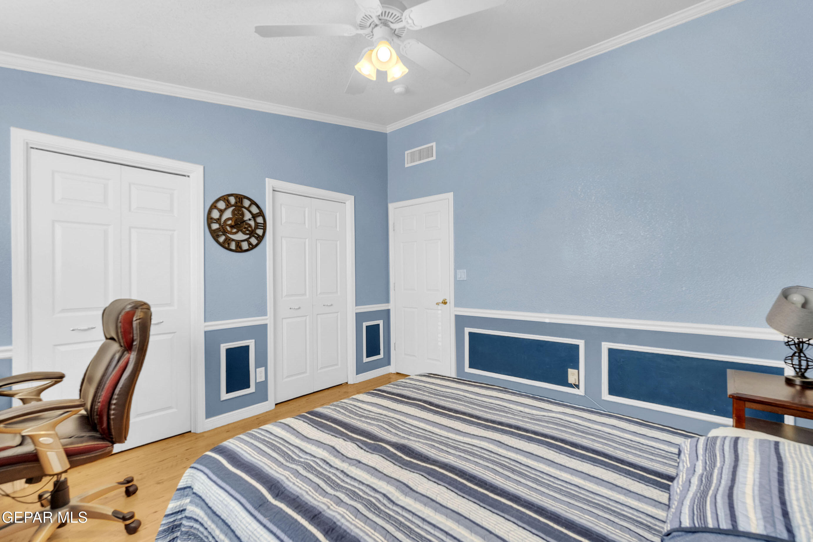 6531 Brook Ridge Circle El Paso, TX 79912 - Photo 43 of 73 a bedroom with a bed and a chandelier