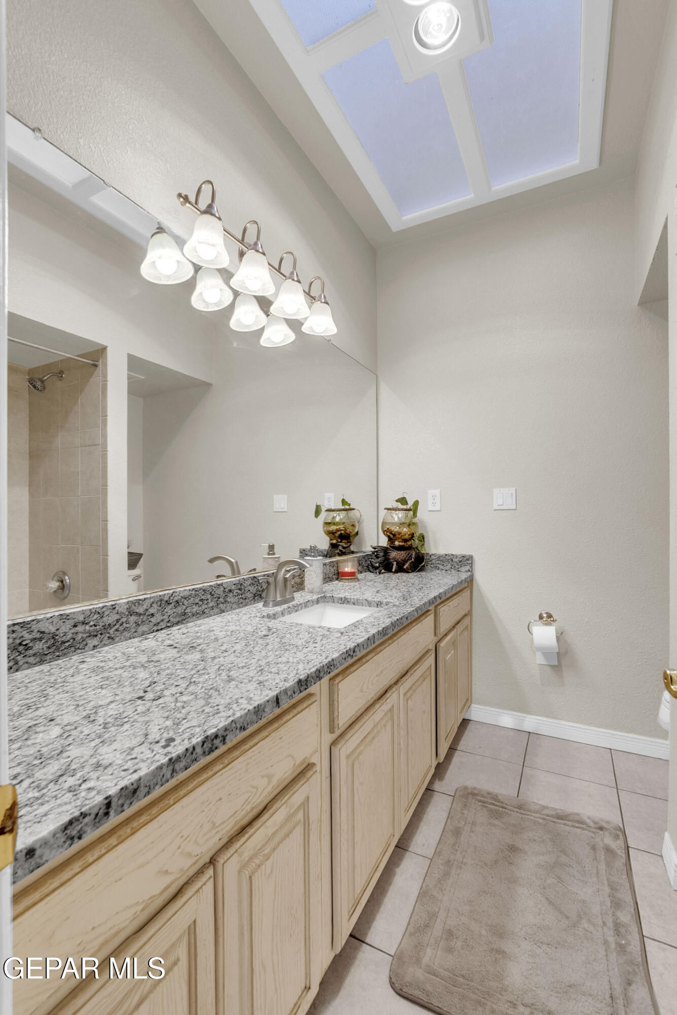 6531 Brook Ridge Circle El Paso, TX 79912 - Photo 52 of 73 a bathroom with a granite countertop double vanity sink and a mirror