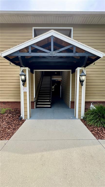 3443 Southwest 24th Street, Unit 101 Gainesville, FL 32608 - Photo 16 of 16 a front view of a house with garage