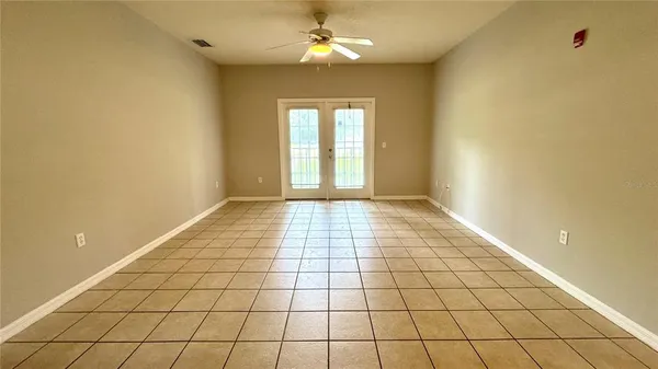 a view of an empty room and window