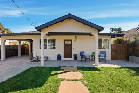 a view of an house with backyard porch and patio