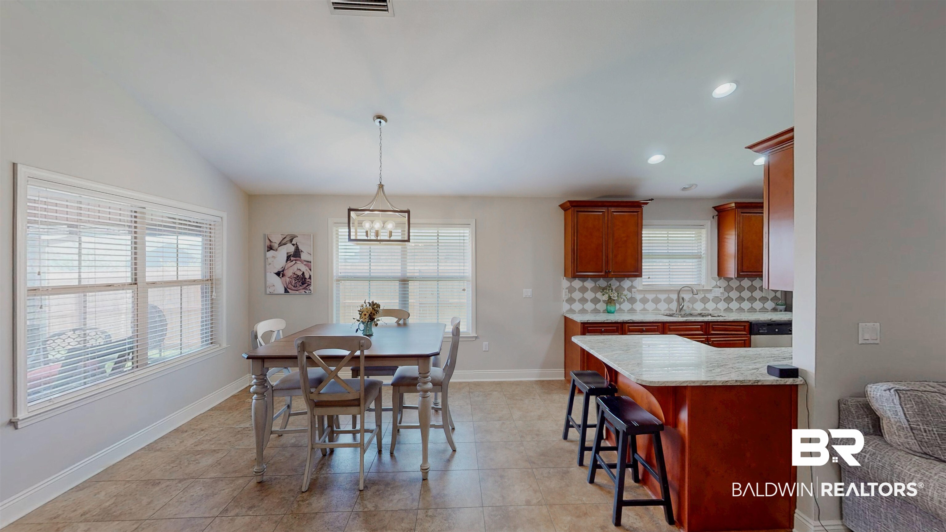 1704 Arcadia Drive Foley, AL 36535 - Photo 22 of 52 Dining area with a chandelier, light tile patterned floors, recessed lighting, and vaulted ceiling