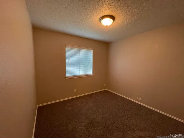 an empty room with a empty space and a window