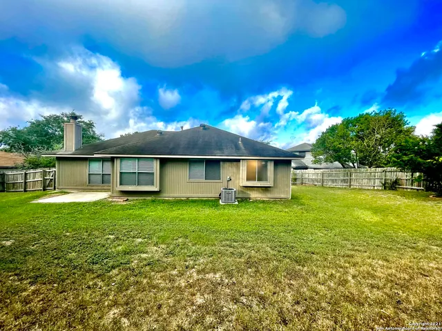 a view of a house with a big yard