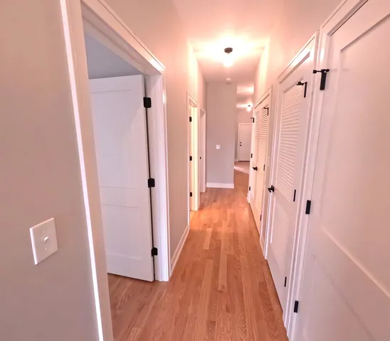 a view of a bathroom from a hallway