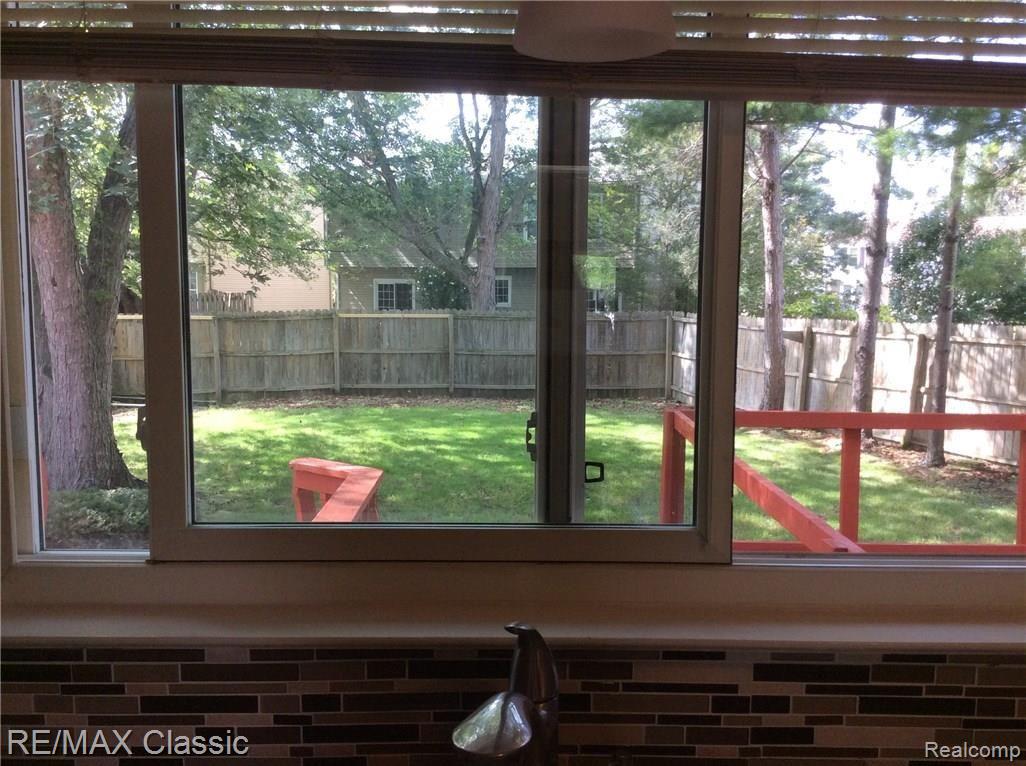 704 Burlington Road Canton, MI 48188 - Photo 20 of 40 From Kitchen sink/window into fully fenced yard