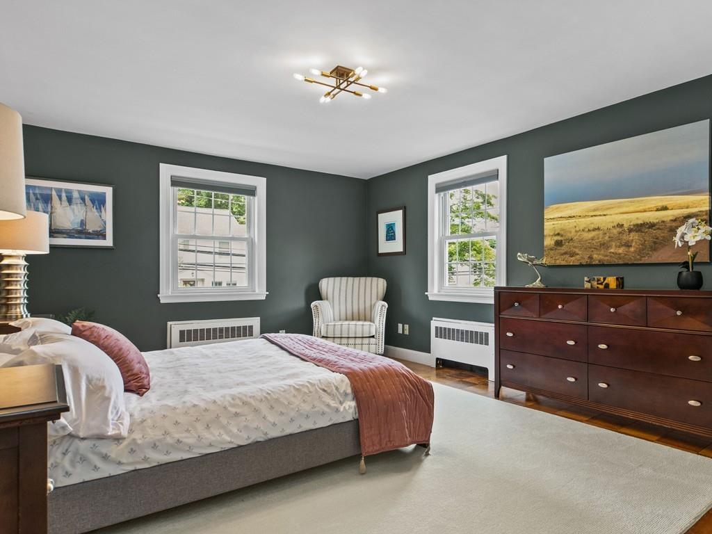 41 Lila Road Boston, MA 02130 - Photo 14 of 39 a bedroom with a bed and wooden floor