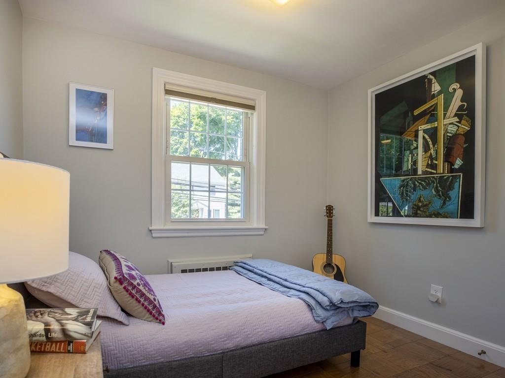 41 Lila Road Boston, MA 02130 - Photo 19 of 39 a bedroom with a bed and a window