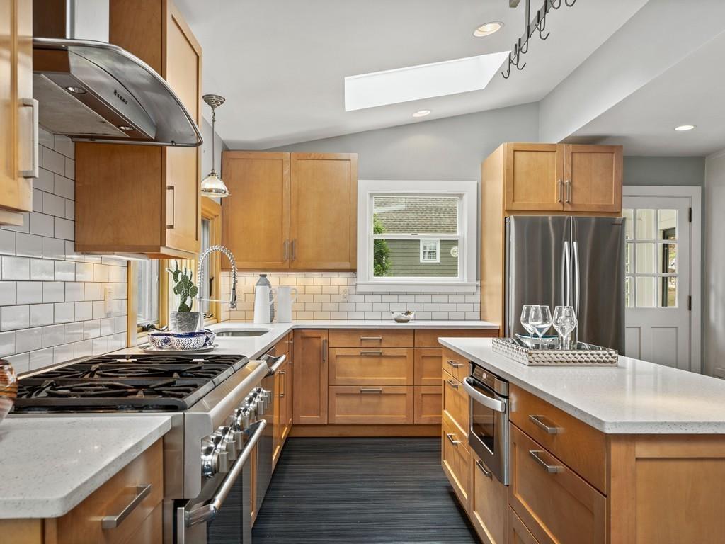 41 Lila Road Boston, MA 02130 - Photo 8 of 39 a large kitchen with stainless steel appliances granite countertop a sink stove and refrigerator