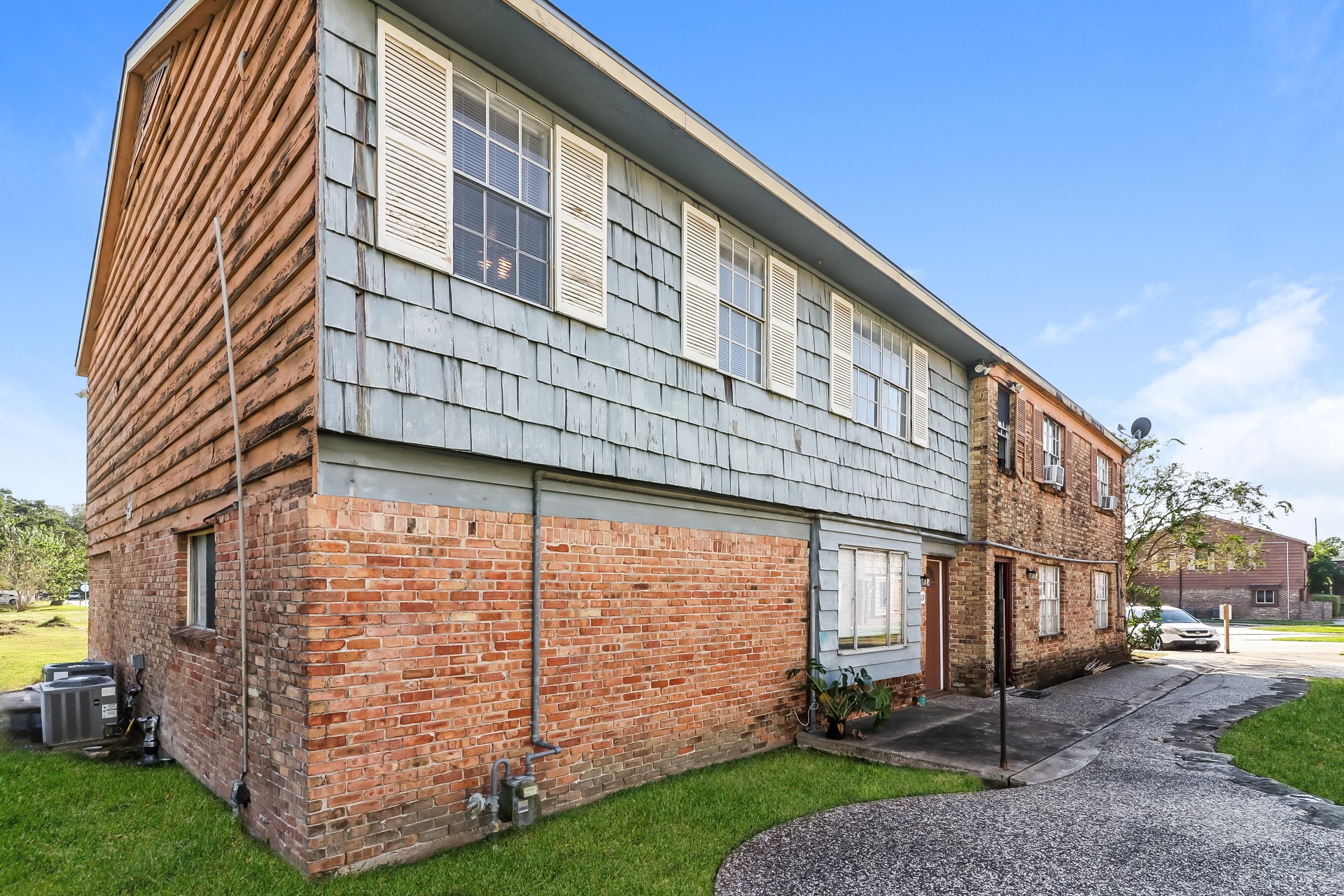 a front view of a building with garden