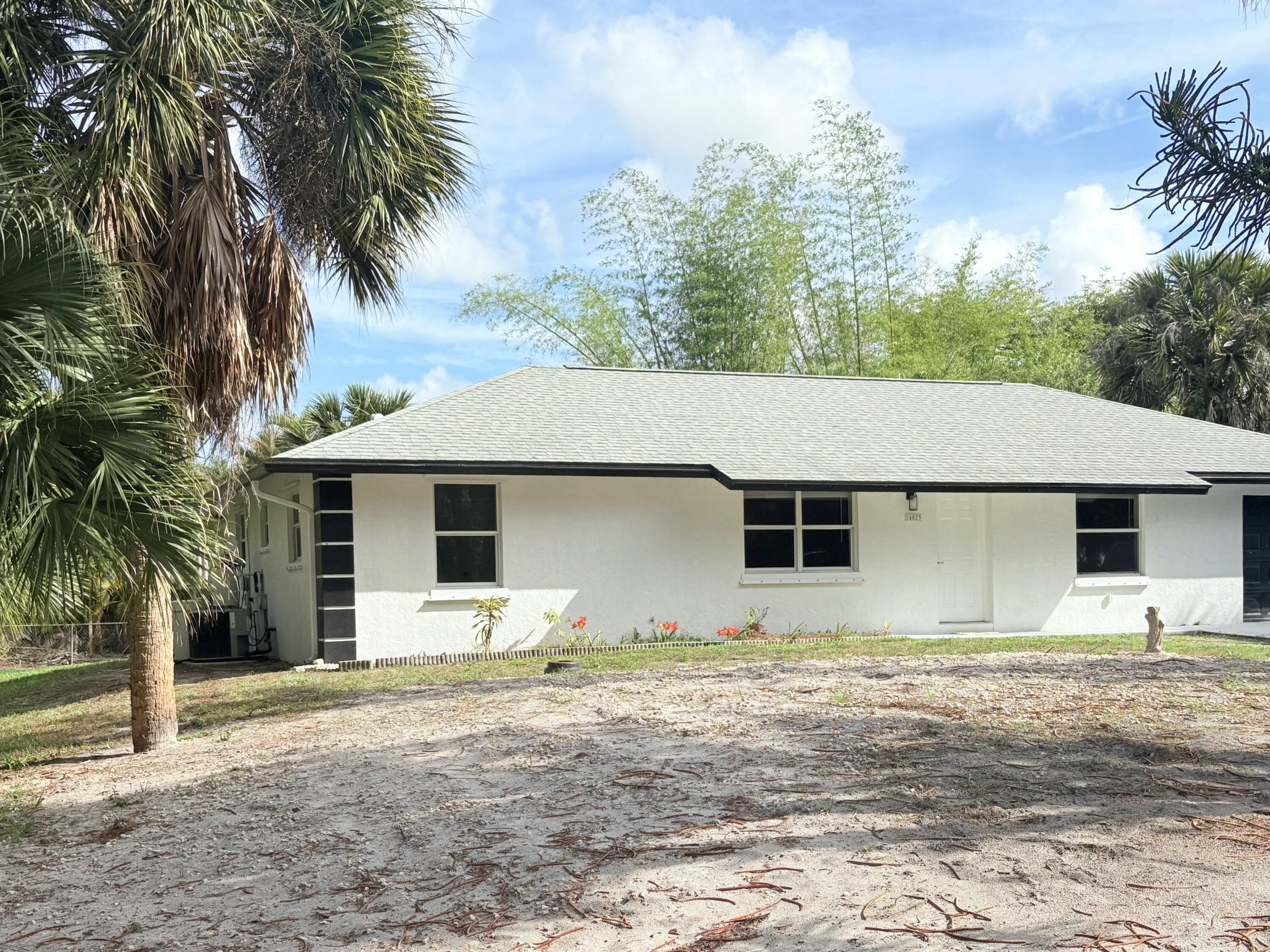 14523 Flamingo Road Loxahatchee Groves, FL 33470 - Photo 21 of 50 a house with a yard