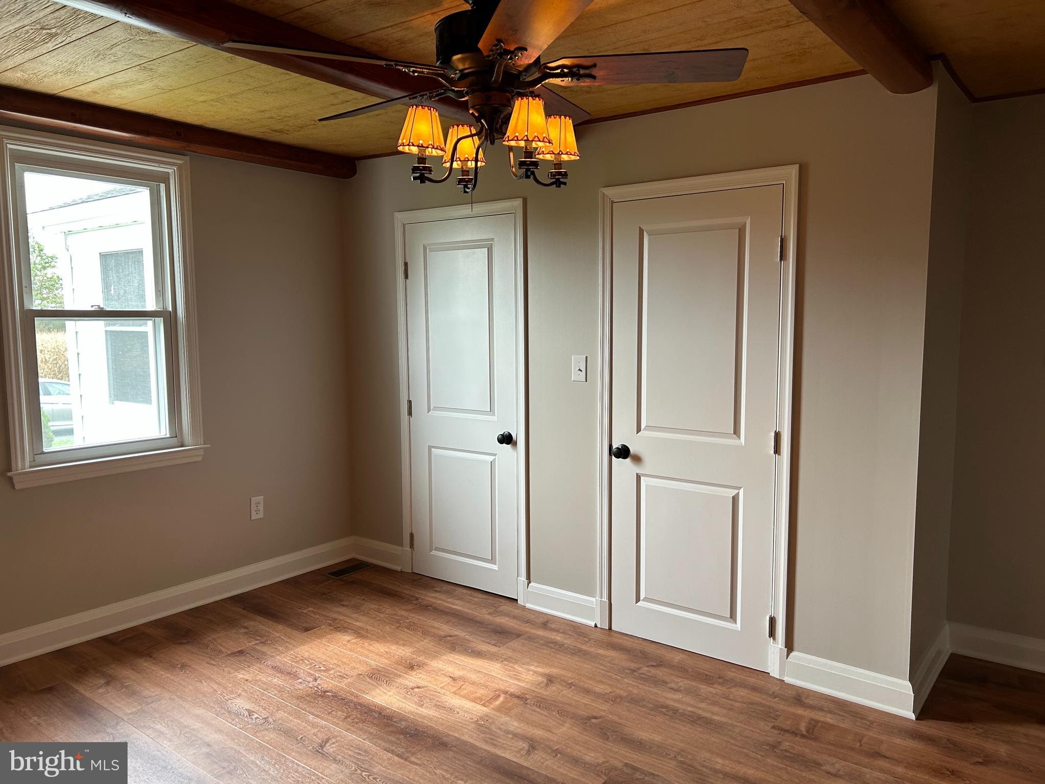 2244 Old Washington Road Westminster, MD 21157 - Photo 18 of 60 a view of empty room with wooden floor and fan
