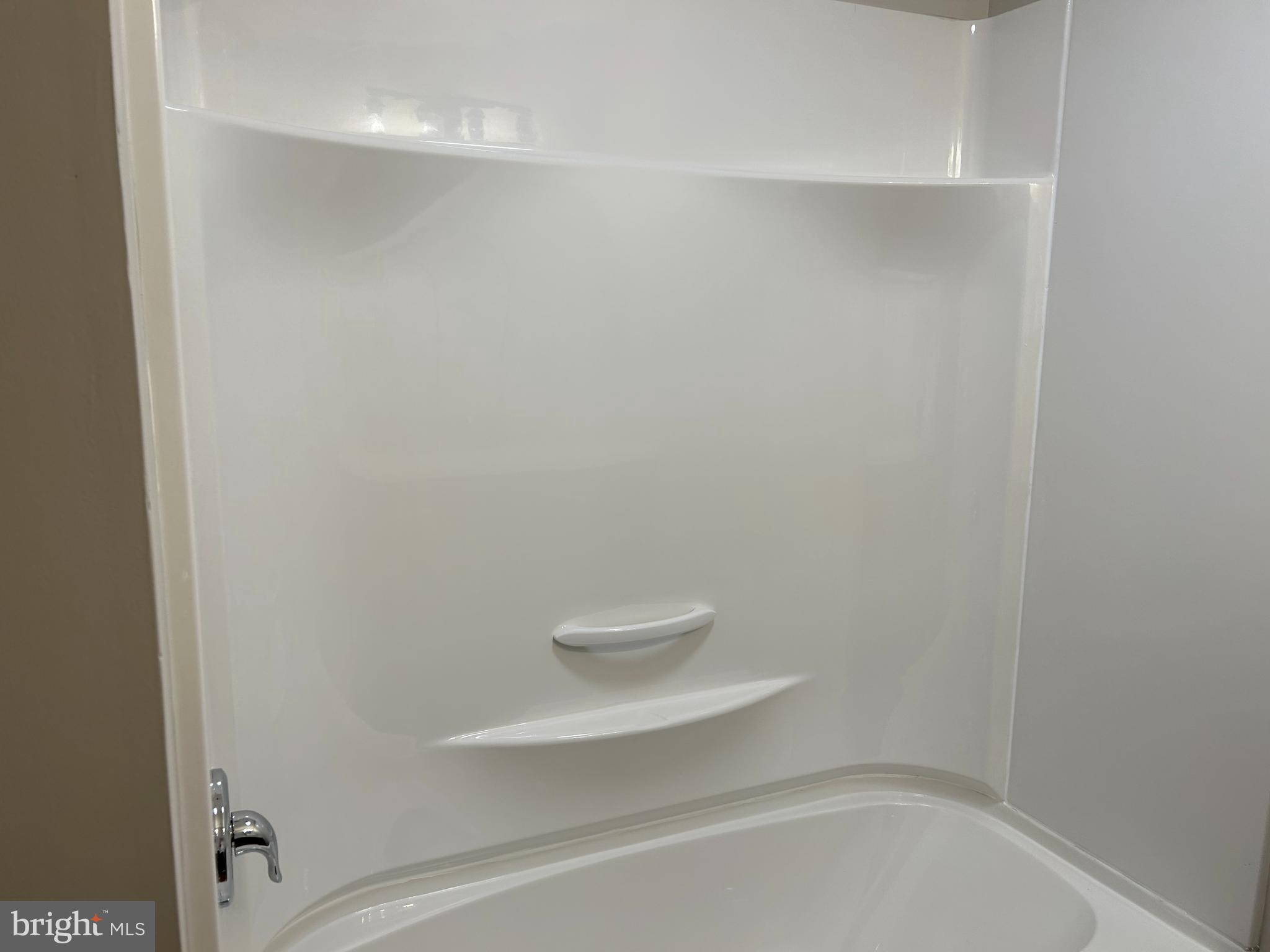 2244 Old Washington Road Westminster, MD 21157 - Photo 23 of 60 a bathroom with a white bath tub