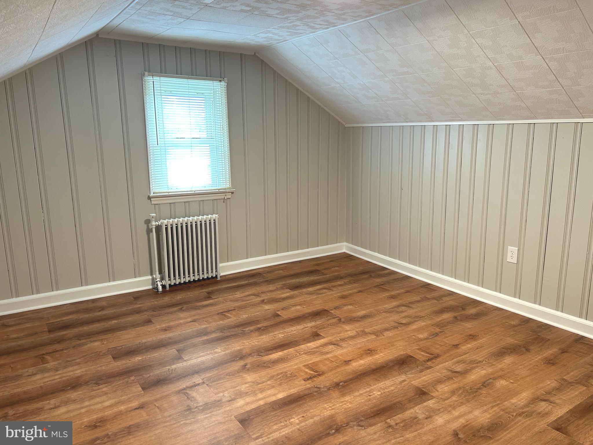 2244 Old Washington Road Westminster, MD 21157 - Photo 28 of 60 an empty room with wooden floor and windows