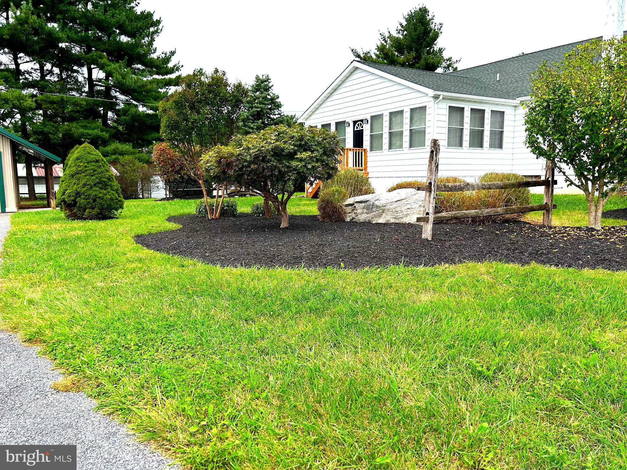 2244 Old Washington Road Westminster, MD 21157 - Photo 33 of 60 a front view of a house with a yard and trees