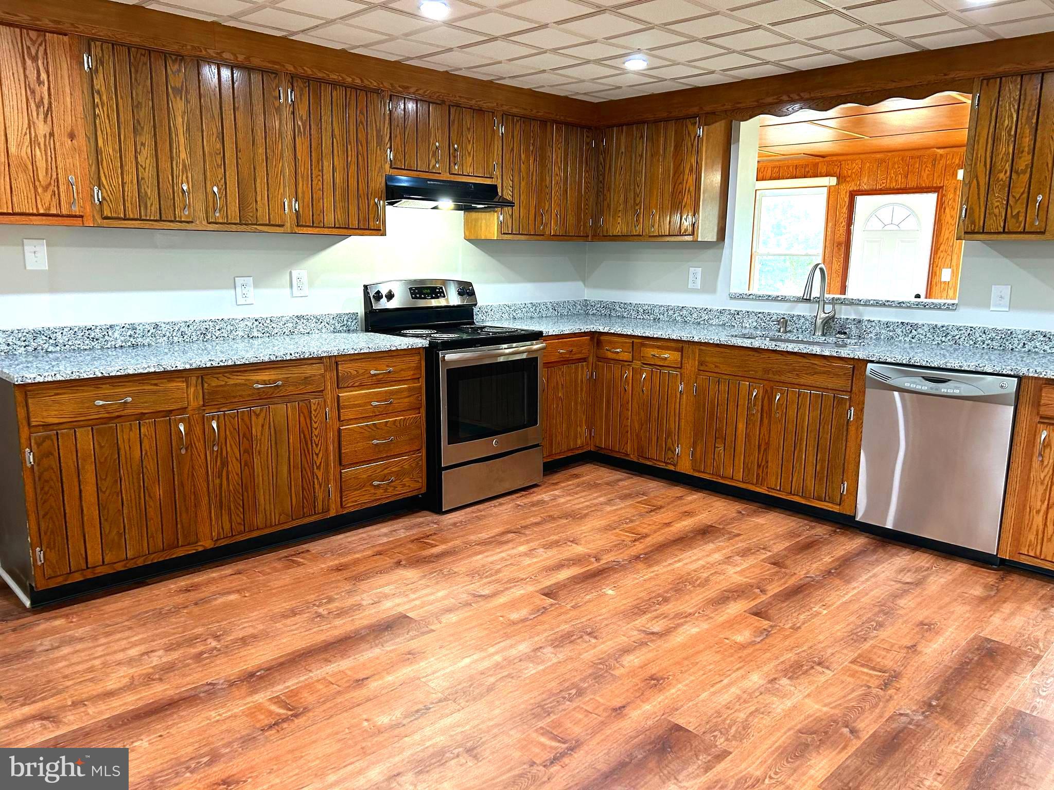 2244 Old Washington Road Westminster, MD 21157 - Photo 5 of 60 a kitchen with granite countertop a sink cabinets and stainless steel appliances