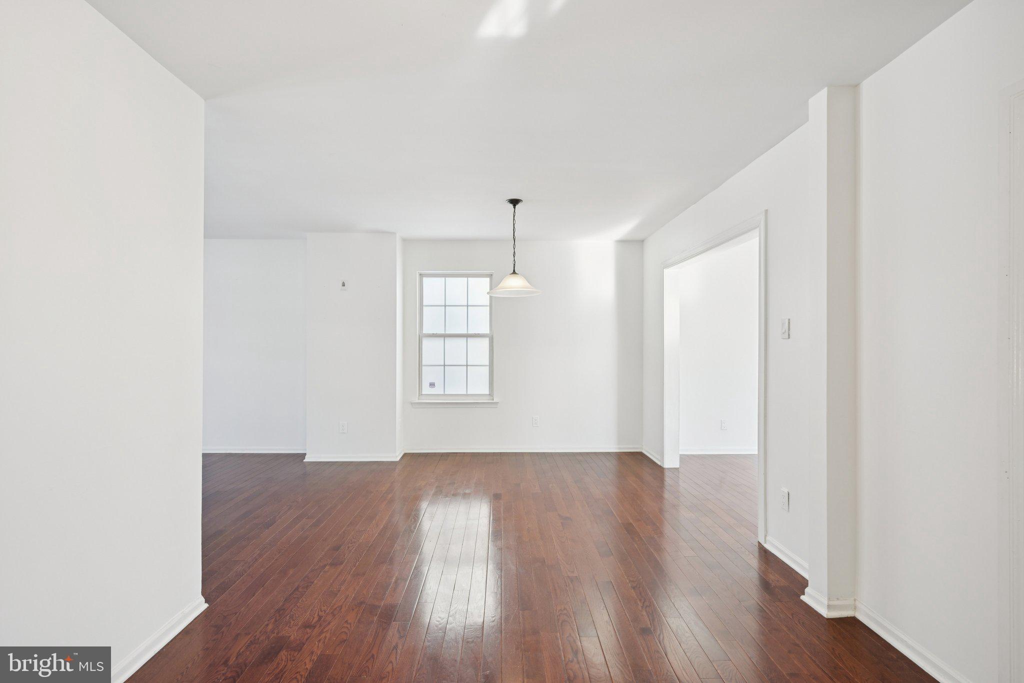 616 Stewart Road Collegeville, PA 19426 - Photo 14 of 56 an empty room with wooden floor and windows