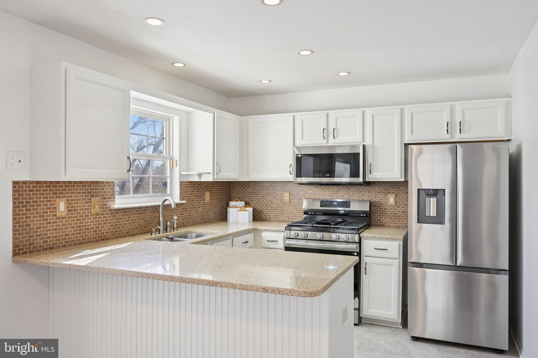 616 Stewart Road Collegeville, PA 19426 - Photo 21 of 56 a kitchen with kitchen island a sink stainless steel appliances and counter space