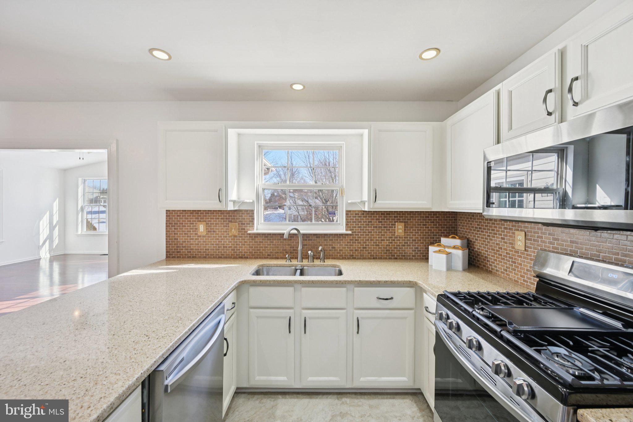 616 Stewart Road Collegeville, PA 19426 - Photo 22 of 56 a kitchen with a sink stove and cabinets