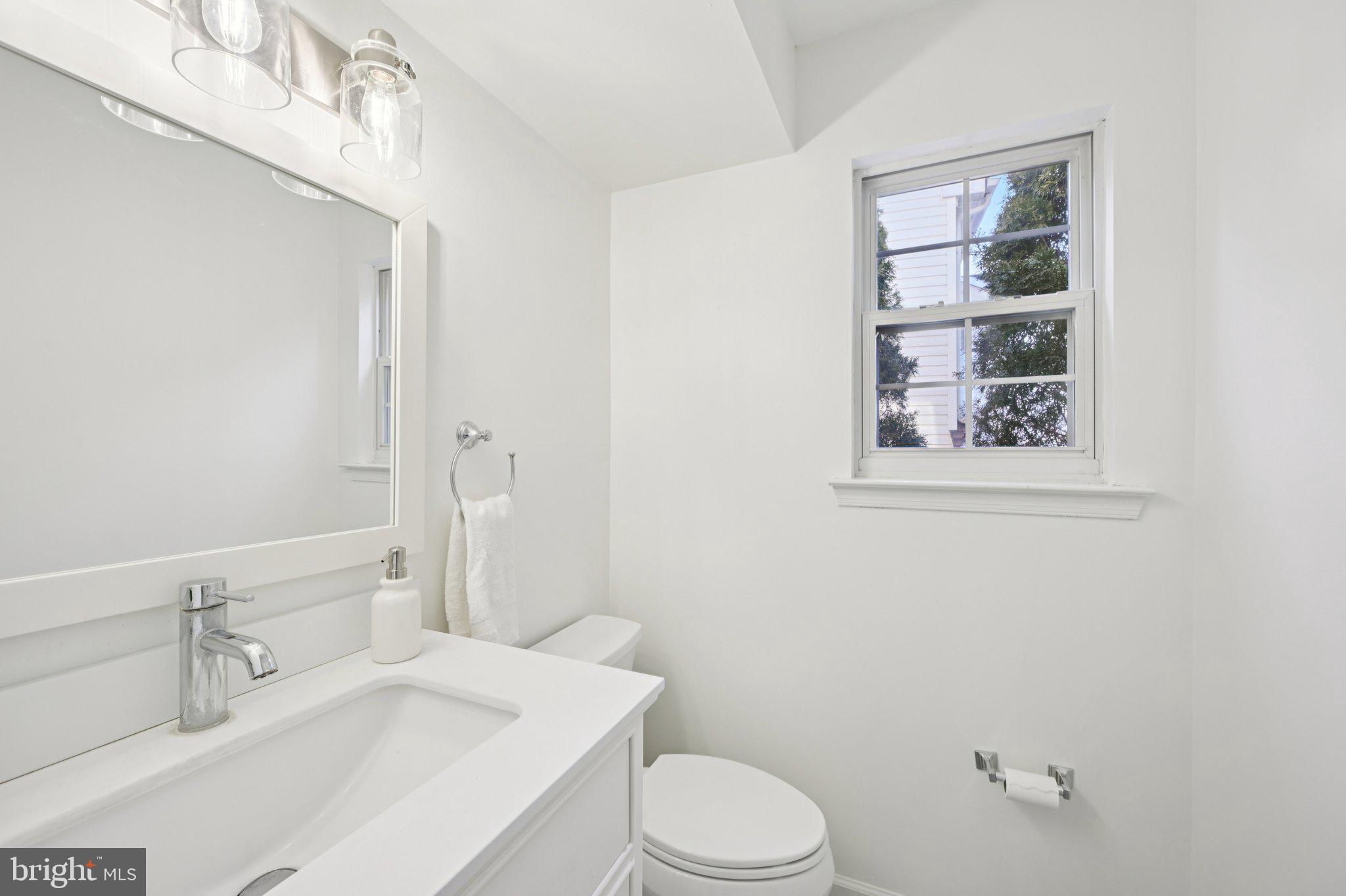 616 Stewart Road Collegeville, PA 19426 - Photo 23 of 56 a bathroom with a toilet a sink and mirror