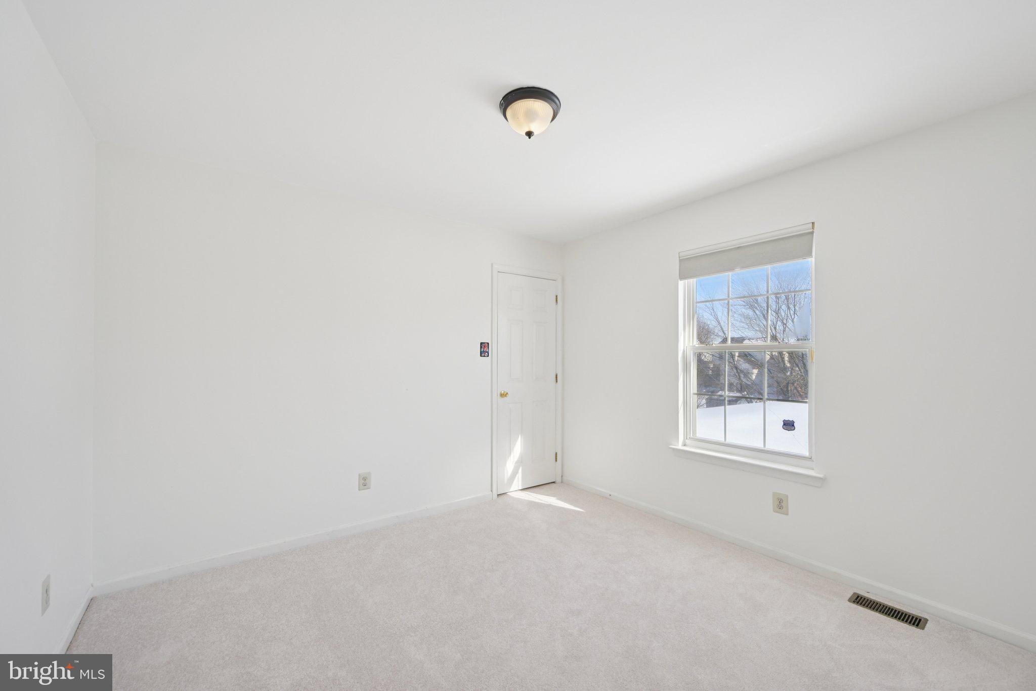 616 Stewart Road Collegeville, PA 19426 - Photo 31 of 56 a view of an empty room with a window