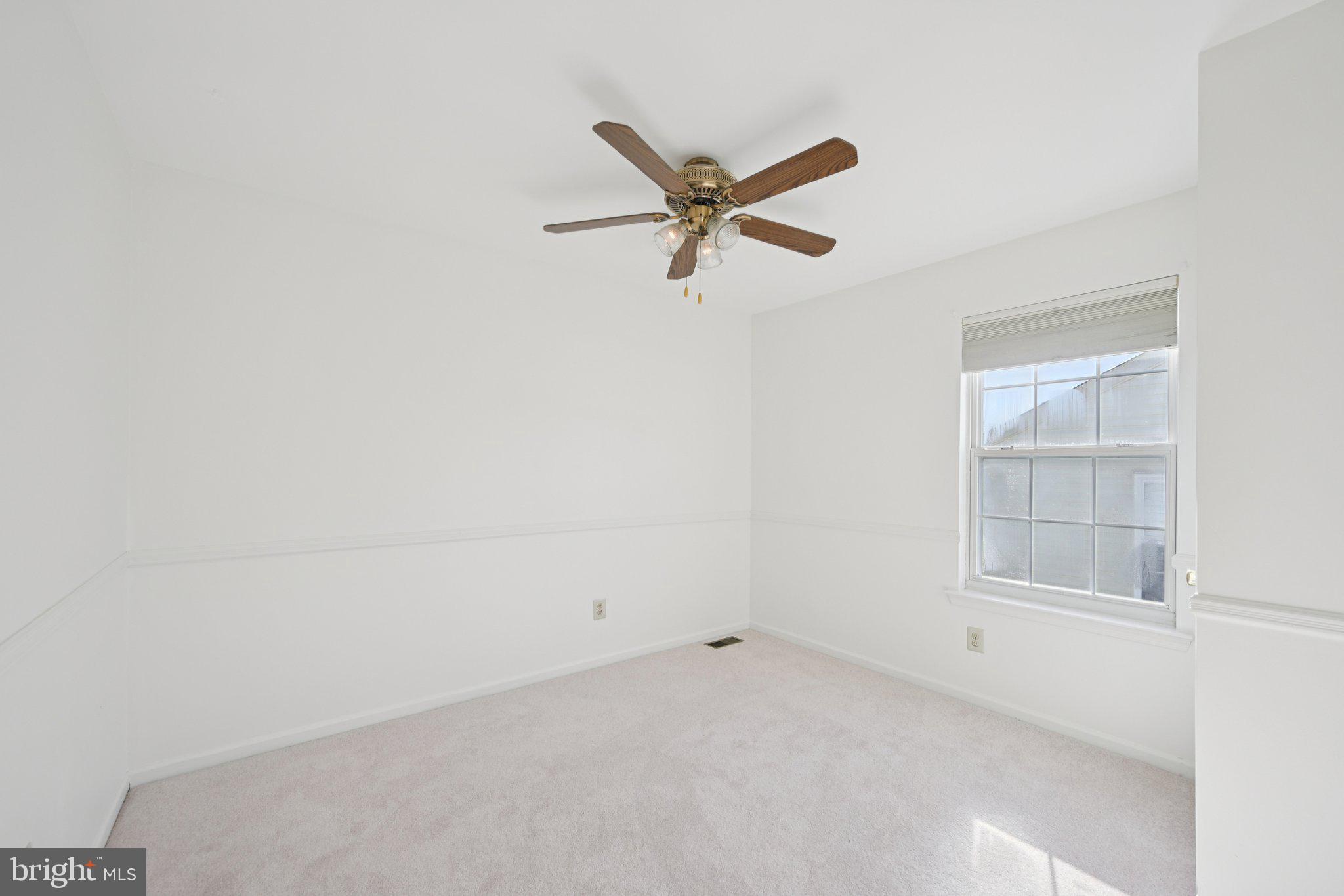 616 Stewart Road Collegeville, PA 19426 - Photo 34 of 56 an empty room with a window and a ceiling fan