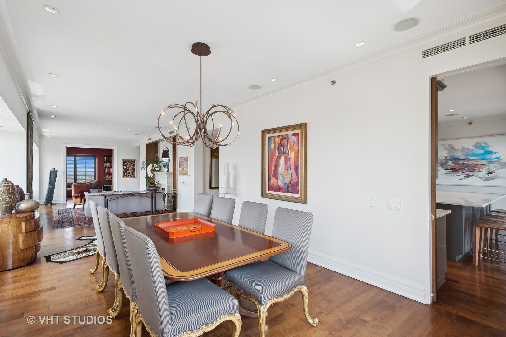 800 North Michigan Avenue, Unit 4702 Chicago, IL 60611 - Photo 15 of 31 a view of a dining room with furniture wooden floor and chandelier