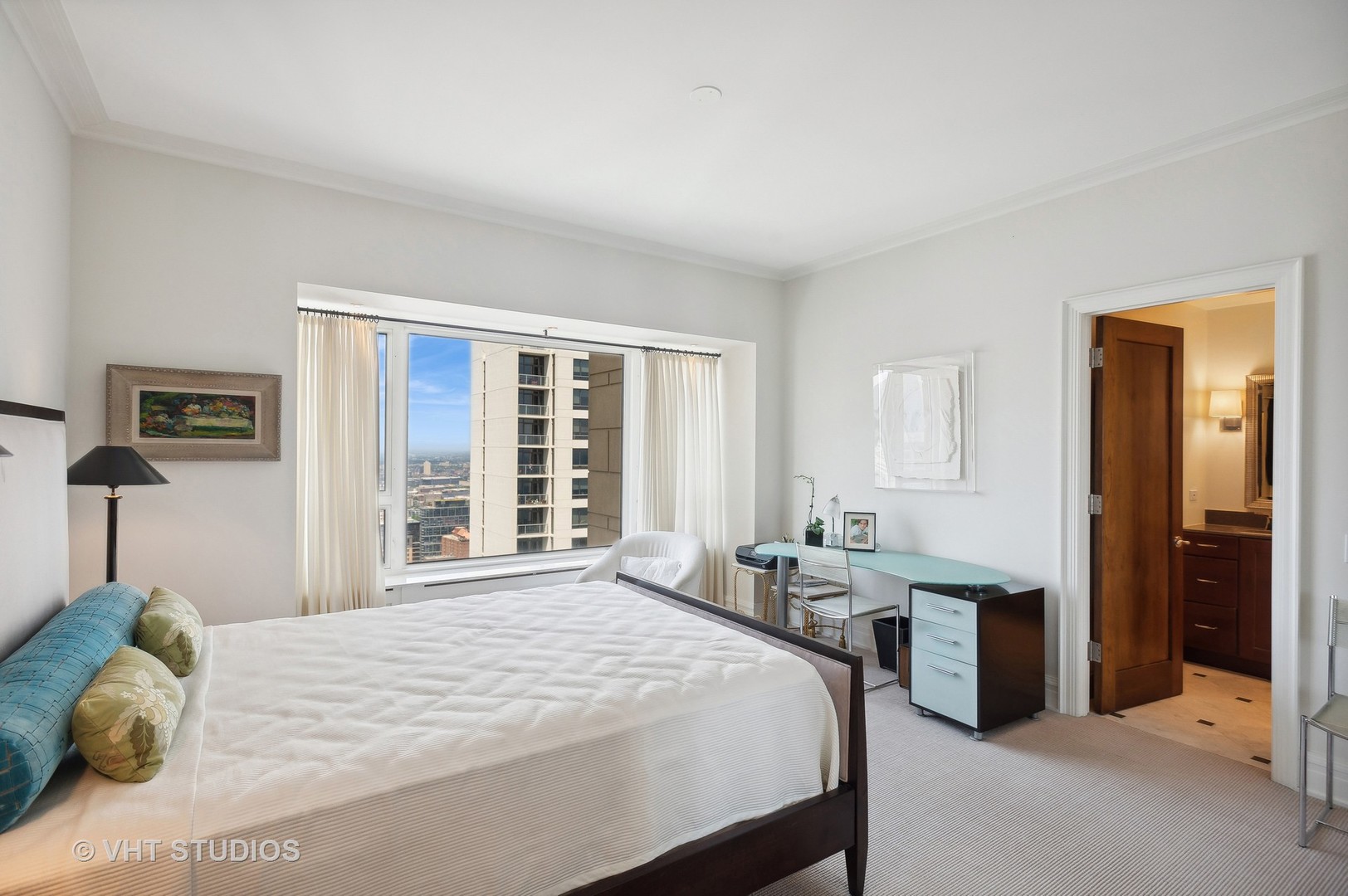 800 North Michigan Avenue, Unit 4702 Chicago, IL 60611 - Photo 22 of 31 a bedroom with a bed and a large window