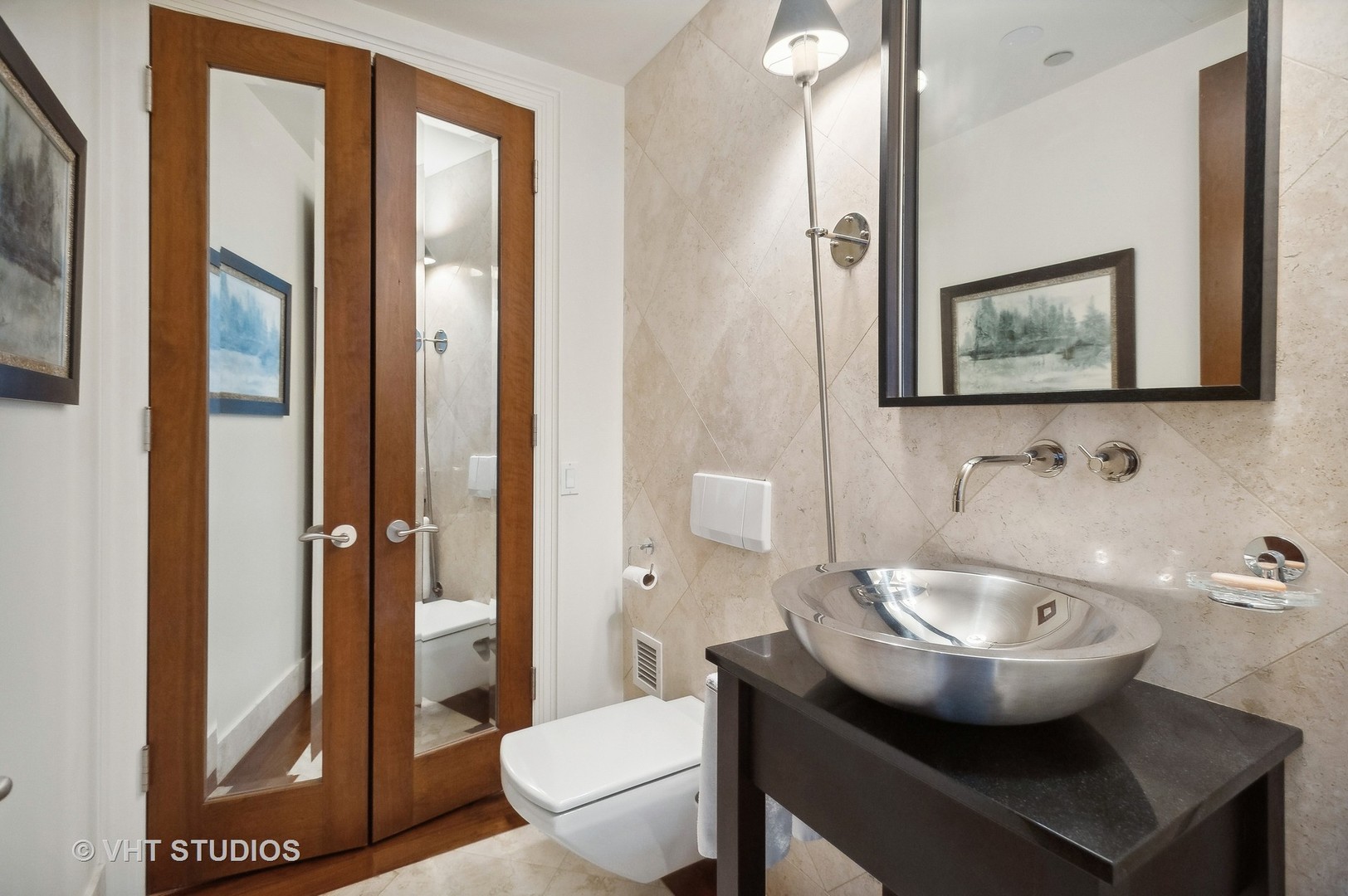 800 North Michigan Avenue, Unit 4702 Chicago, IL 60611 - Photo 25 of 31 a bathroom with a toilet a sink and mirror