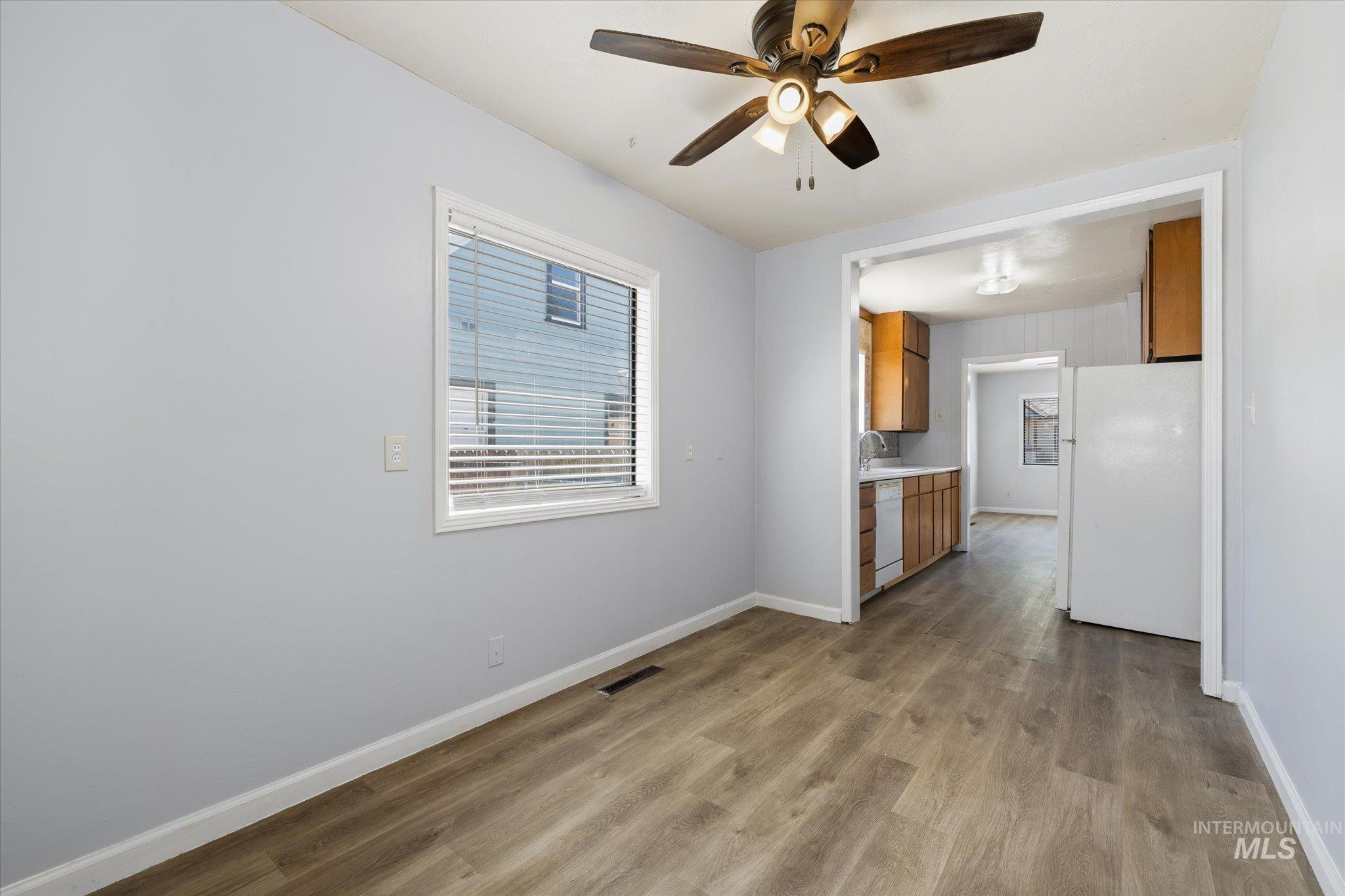 918 West 3rd Street Weiser, ID 83672 - Photo 21 of 36 Light-toned wood-finish flooring extends throughout, complemented by light grey walls and white trim