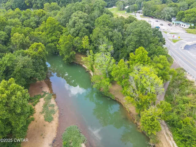 a view of a lake with a yard