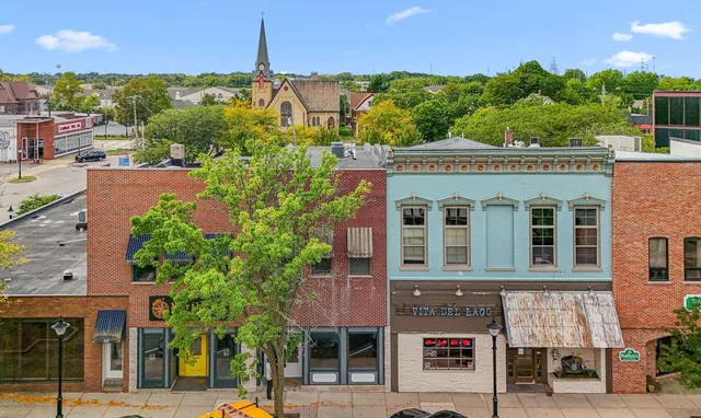 a front view of a building with street view