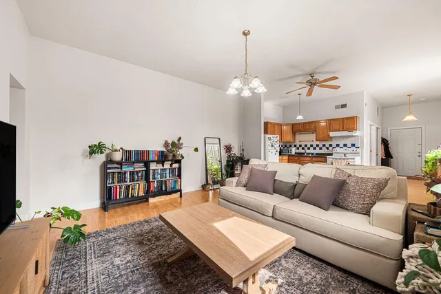 a living room with furniture and a table