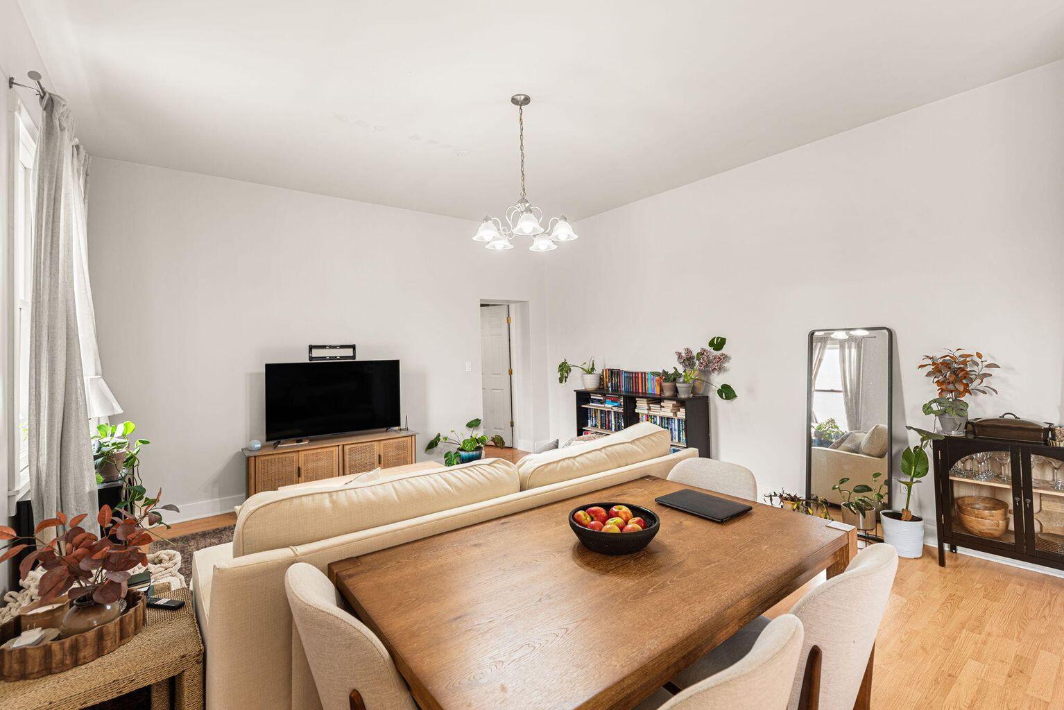 525 Franklin Street, Unit 3 Michigan City, IN 46360 - Photo 4 of 8 a living room with furniture and a flat screen tv