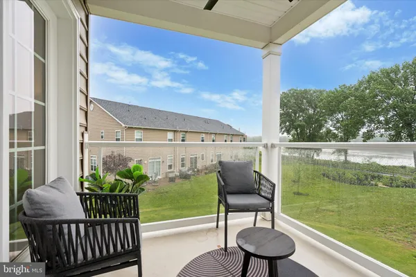 a view of a balcony with chairs
