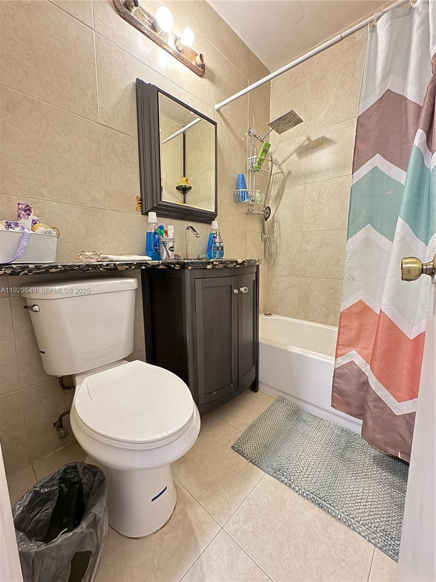 343 West 42nd Street, Unit A Hialeah, FL 33012 - Photo 10 of 13 a bathroom with a toilet a sink and bathtub