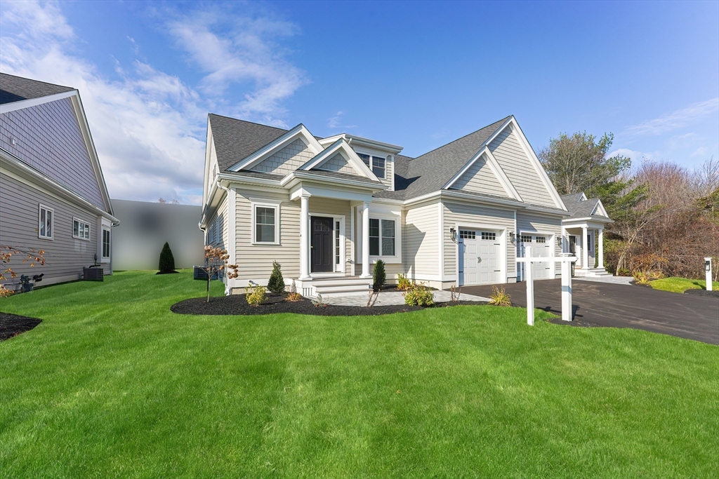 3 Damon Road, Unit 12 Needham Heights, MA 02494 - Photo 1 of 16 a front view of a house with swimming pool and garden
