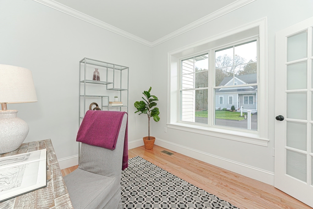 3 Damon Road, Unit 12 Needham Heights, MA 02494 - Photo 13 of 16 a living room with furniture and a window