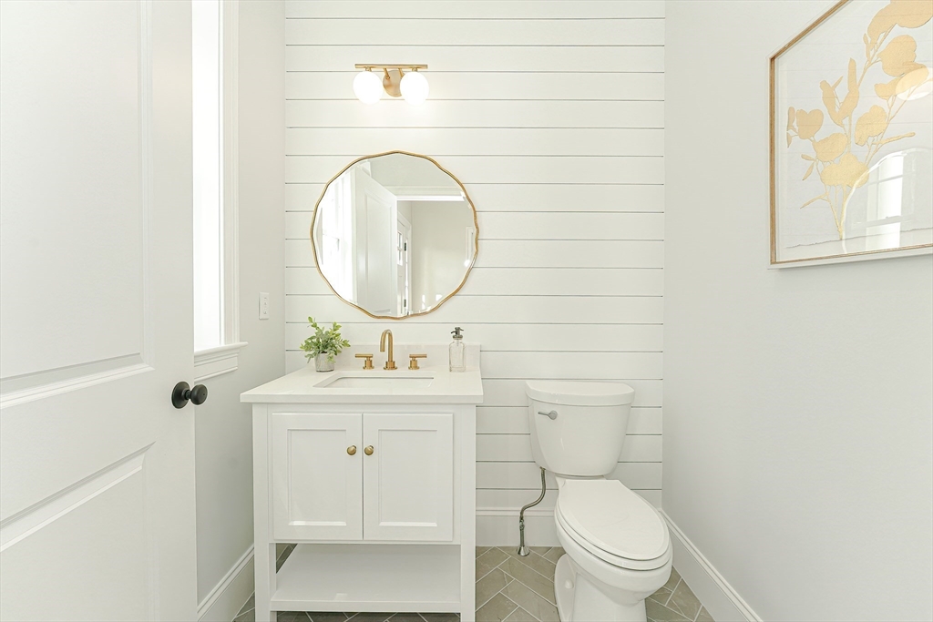 3 Damon Road, Unit 12 Needham Heights, MA 02494 - Photo 14 of 16 a bathroom with a toilet a sink and a mirror