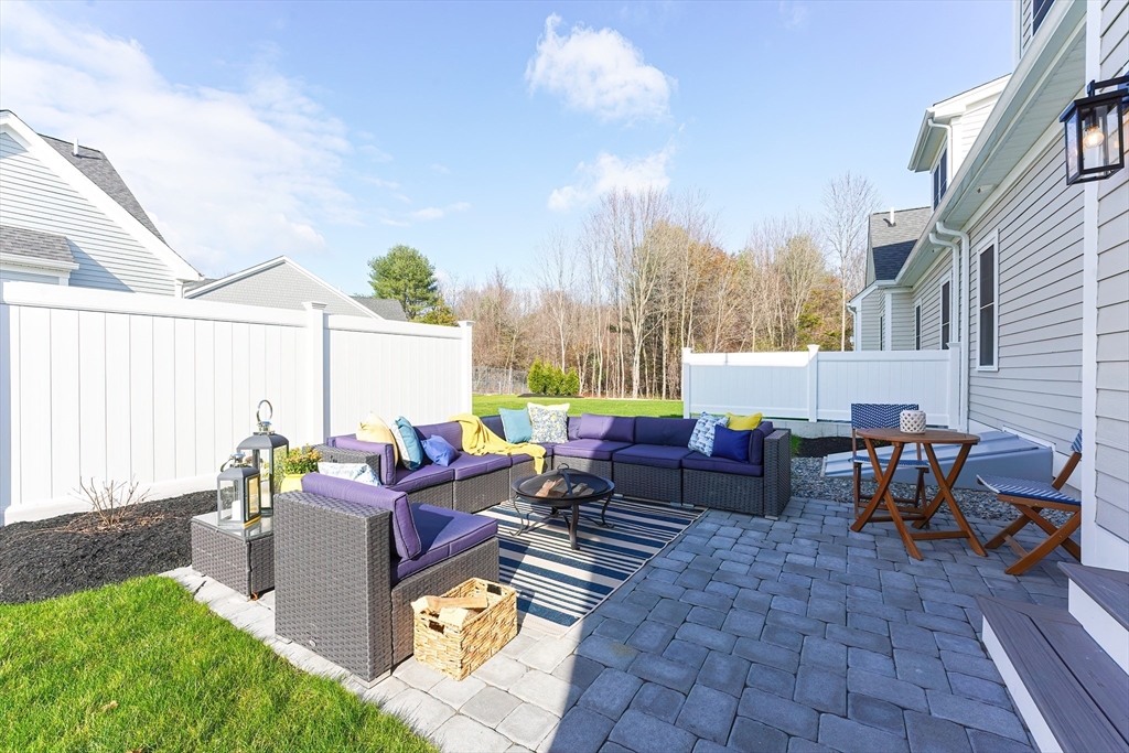 3 Damon Road, Unit 12 Needham Heights, MA 02494 - Photo 2 of 16 a living room with patio furniture