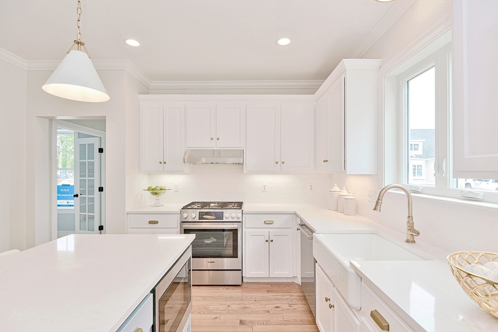 3 Damon Road, Unit 12 Needham Heights, MA 02494 - Photo 6 of 16 a kitchen that has a lot of white cabinets and stainless steel appliances